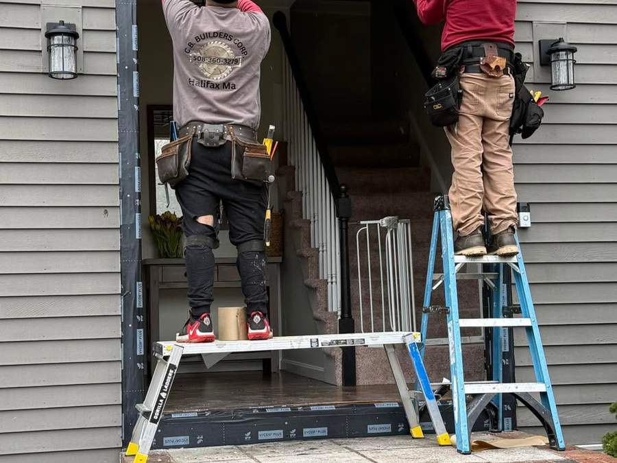 CB Builders Corp. crew setting a new custom Therma-Tru entry door on a South Shore home